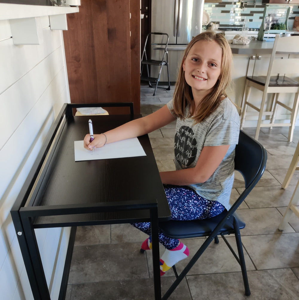 3-girl-writing-at-fold-up-desk