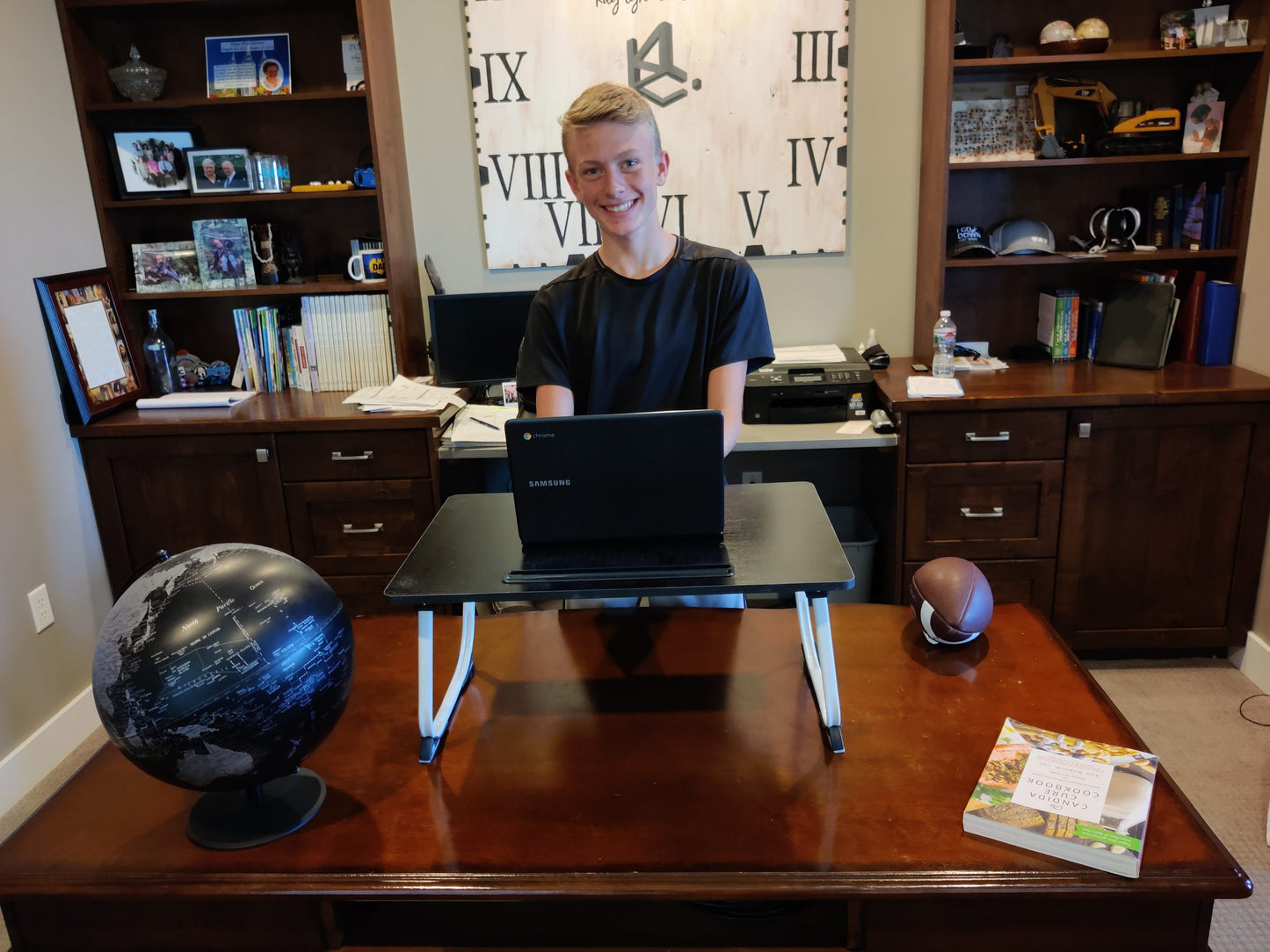 boy with fold down table with chromebook